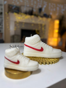 A stylish Nike Jordan 1 high-top shoe-inspired candle wax decor piece, perfect for trendy home accents and fashion-forward interior design. This limited edition collectible features iconic sneaker design elements, making it a unique and artistic statement piece. Ideal for enthusiasts of streetwear and exclusive releases, this decorative item adds flair to any space and makes for a distinctive and fashionable gift.