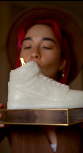 A stylish Nike Jordan 1 high-top shoe-inspired candle wax decor piece, perfect for trendy home accents and fashion-forward interior design. This limited edition collectible features iconic sneaker design elements, making it a unique and artistic statement piece. Ideal for enthusiasts of streetwear and exclusive releases, this decorative item adds flair to any space and makes for a distinctive and fashionable gift.