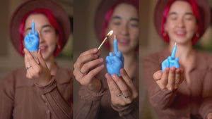  middle finger, candle, rebellion, protest, defiance, expression, gesture, humor, unconventional, statement, controversy, controversial, bold, irreverent, dissent, iconoclast, nonconformity, rebellion, unconventional art